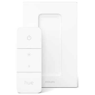 Ein weißer Philips Hue Dimmschalter vor einer Wandhalterung. Der Schalter hat ein Ein-/Ausschaltknopf und Tasten zur Helligkeitsanpassung.