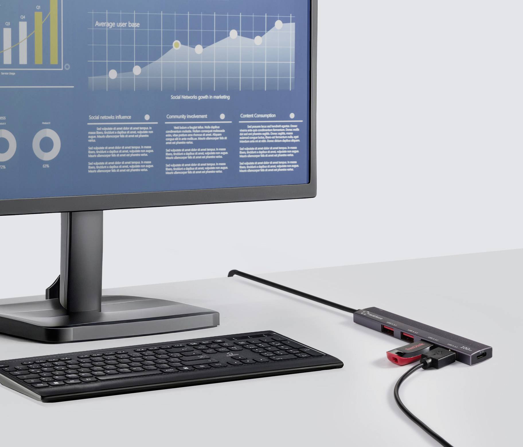 Ein Computermonitor zeigt eine Grafik mit aufsteigender Trendlinie und Daten. Auf dem Tisch befinden sich eine Tastatur und ein verbundenes Gerät.