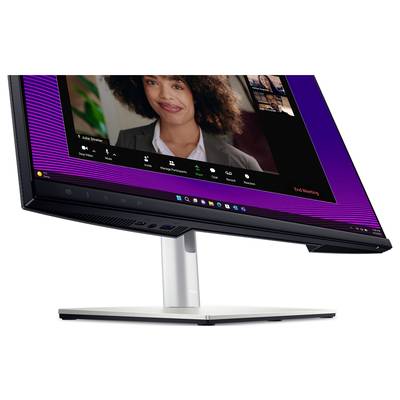 Ein Desktop-Monitor zeigt ein Videokonferenz-Tool mit einer Frau im Gespräch. Unten sind Symbole für Teilnehmerverwaltung und das Beenden des Meetings.