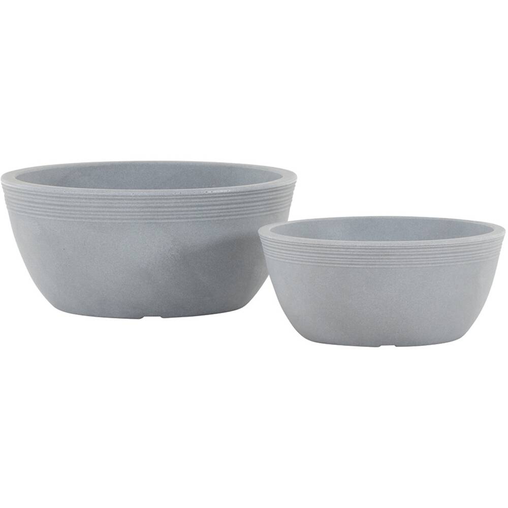 Zwei graue Schalen aus Keramik, eine größere und eine kleinere, nebeneinander stehend. Schlichtes Design mit geripptem Rand.
