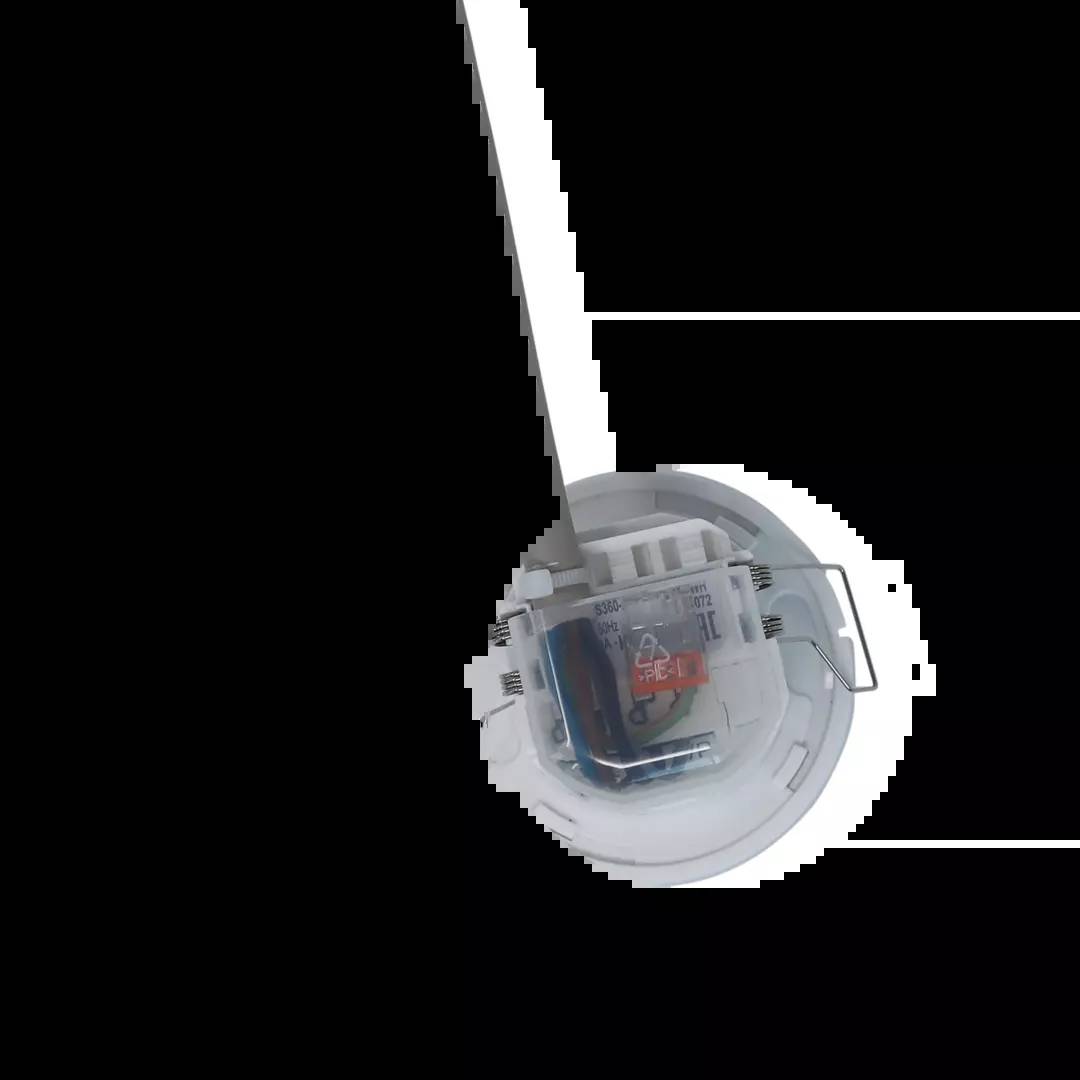 Ein moderner, runder elektrischer Schalter ist in einer weißen Wand eingebaut, teilweise durch einen Schatten verdeckt.