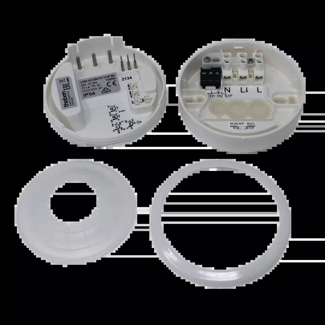 Ein geöffnetes elektrisches Gerät mit sichtbaren Anschlüssen und Platinen, bestehend aus mehreren abnehmbaren weißen Kunststoffteilen.