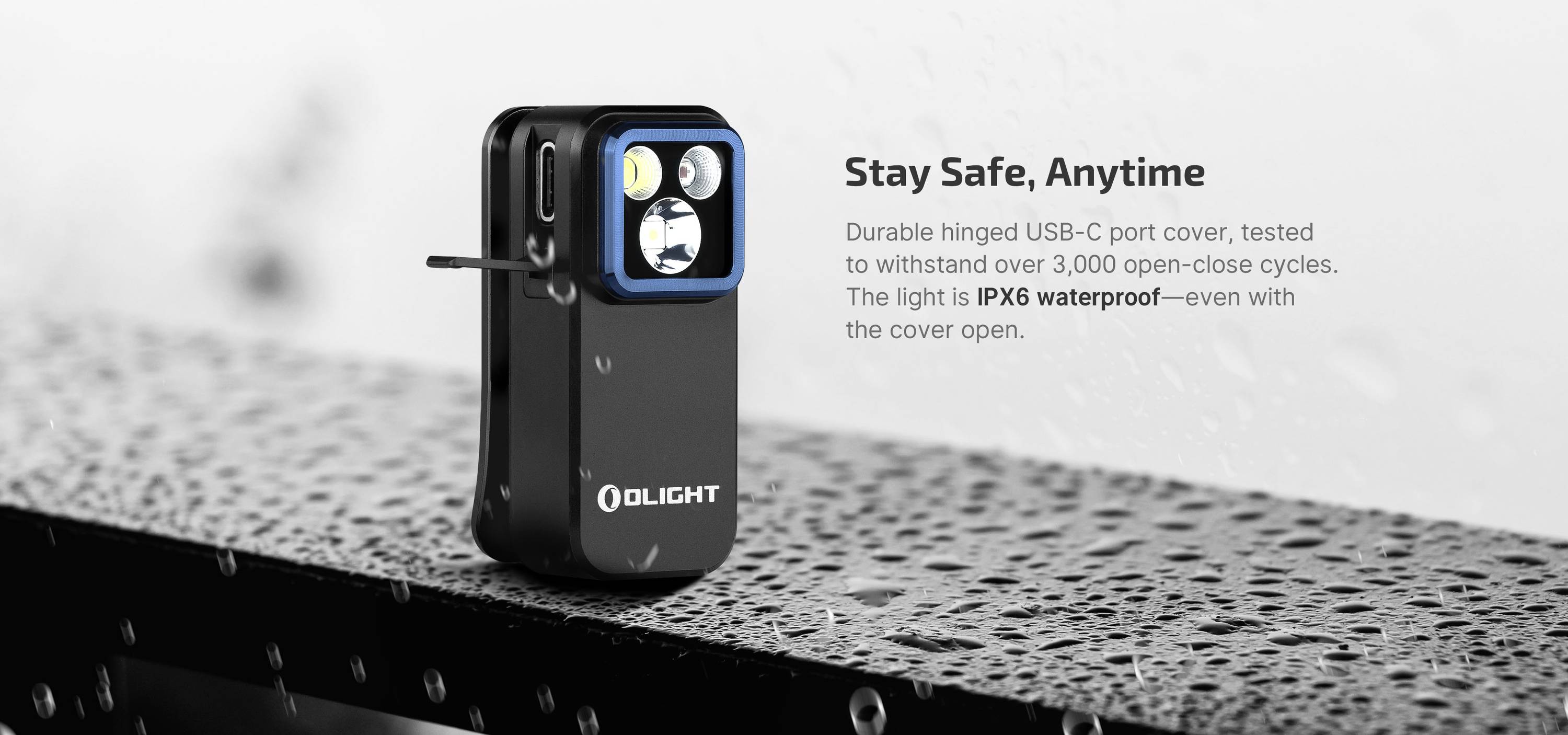 Ein robustes Olight-USB-C-Licht auf einer nassen Oberfläche, textlich hervorgehoben als 'IPX6 wasserfest'.