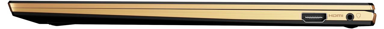 Ein schlanker, geschlossener Laptop in Gold mit einem HDMI-Anschluss und einem Audioanschluss an der Seite, vor weißem Hintergrund.
