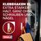 Eine Jacke hängt an einem weißen Klebehaken auf einer Holzoberfläche. Text: 'Klebehaken XL, extra starker Halt, ganz ohne Schrauben und Nägel'.