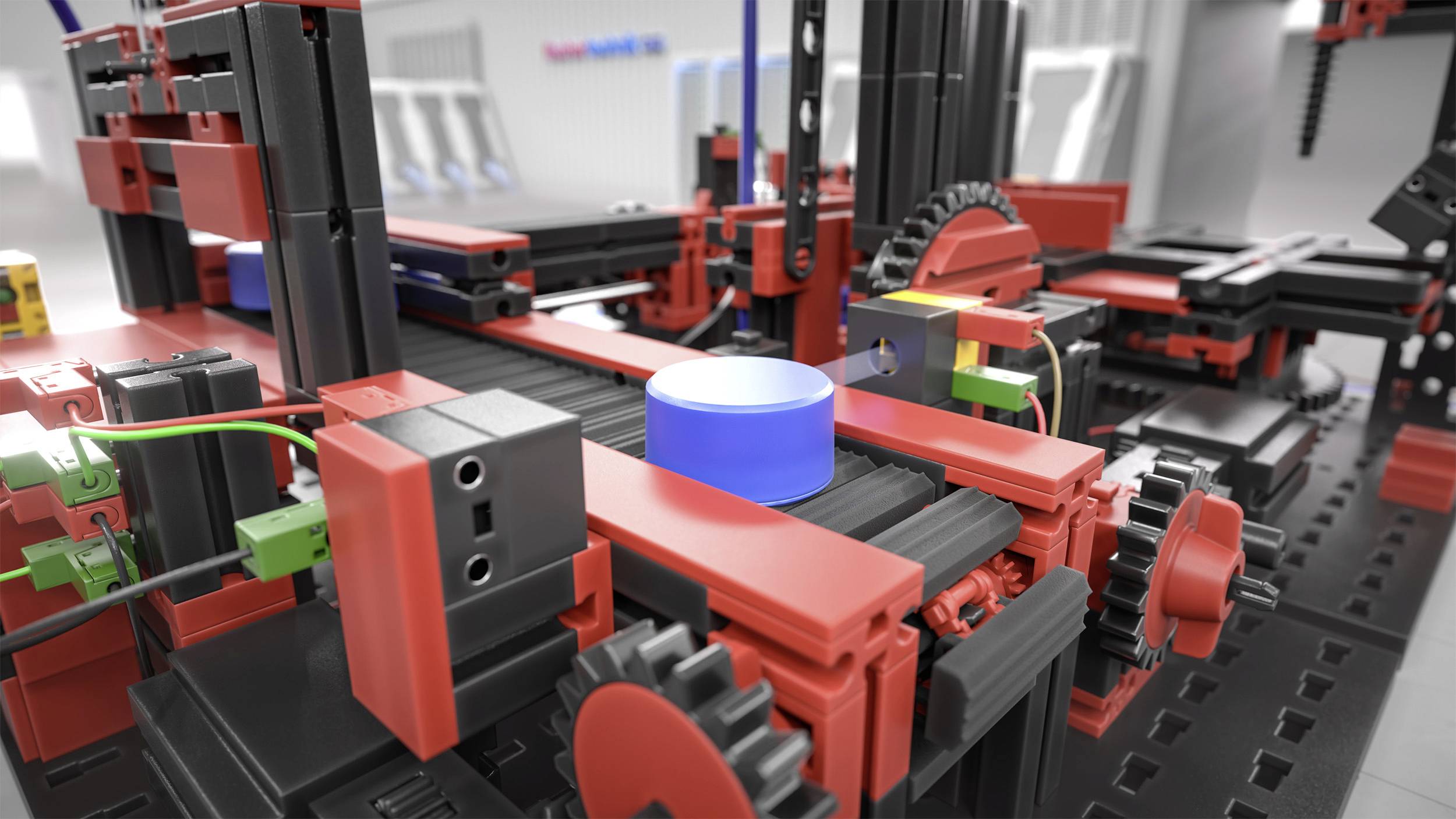 Industrieanlage aus roten und schwarzen Bauteilen mit blauen Knopf in der Mitte. Zahnräder und Kabel deuten auf eine Produktionslinie hin.