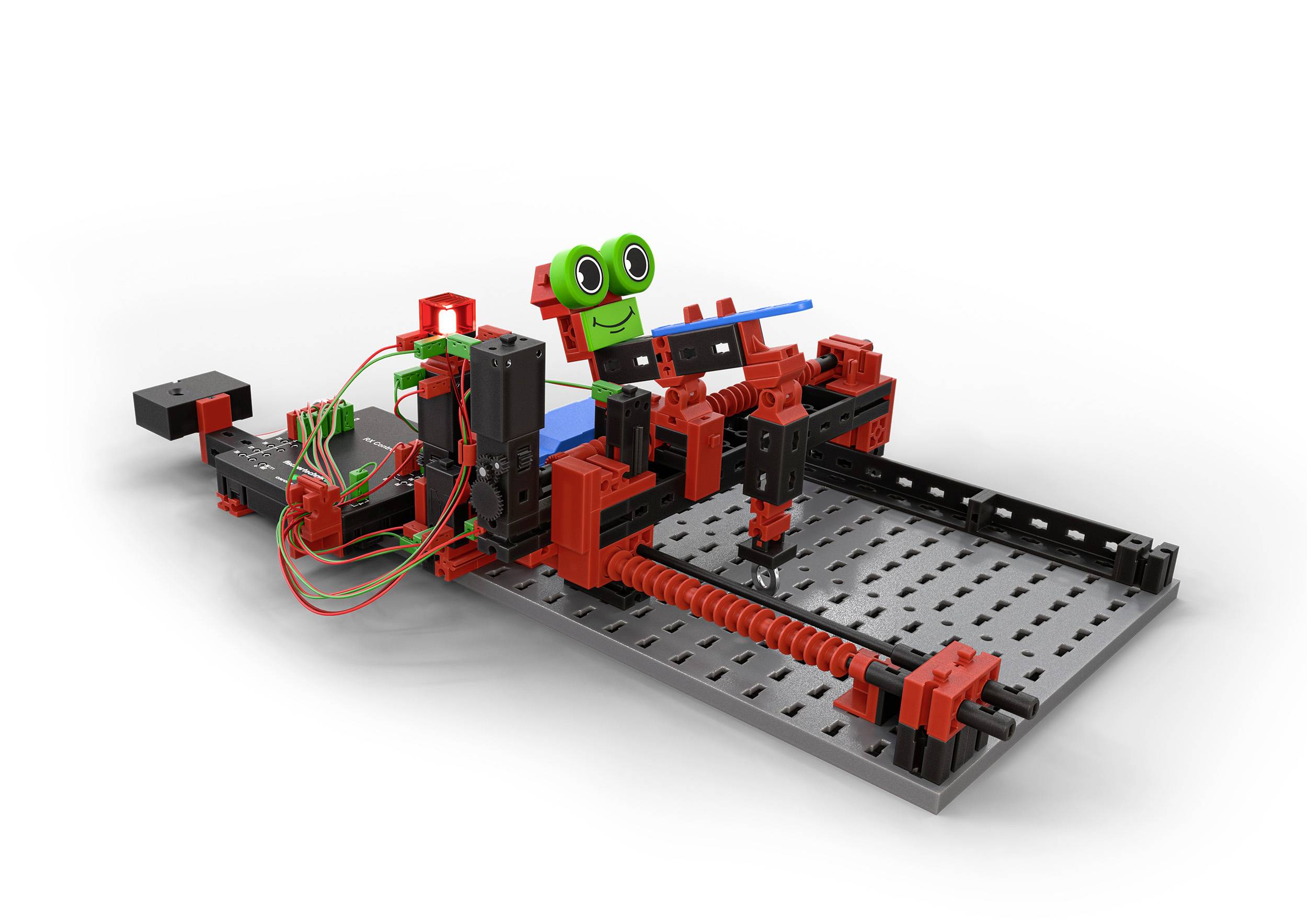 Spielzeug-Roboterbaukasten mit roten und schwarzen Komponenten, bestehend aus Zahnrädern, Kabeln und einem grünen Gesicht mit Augen.
