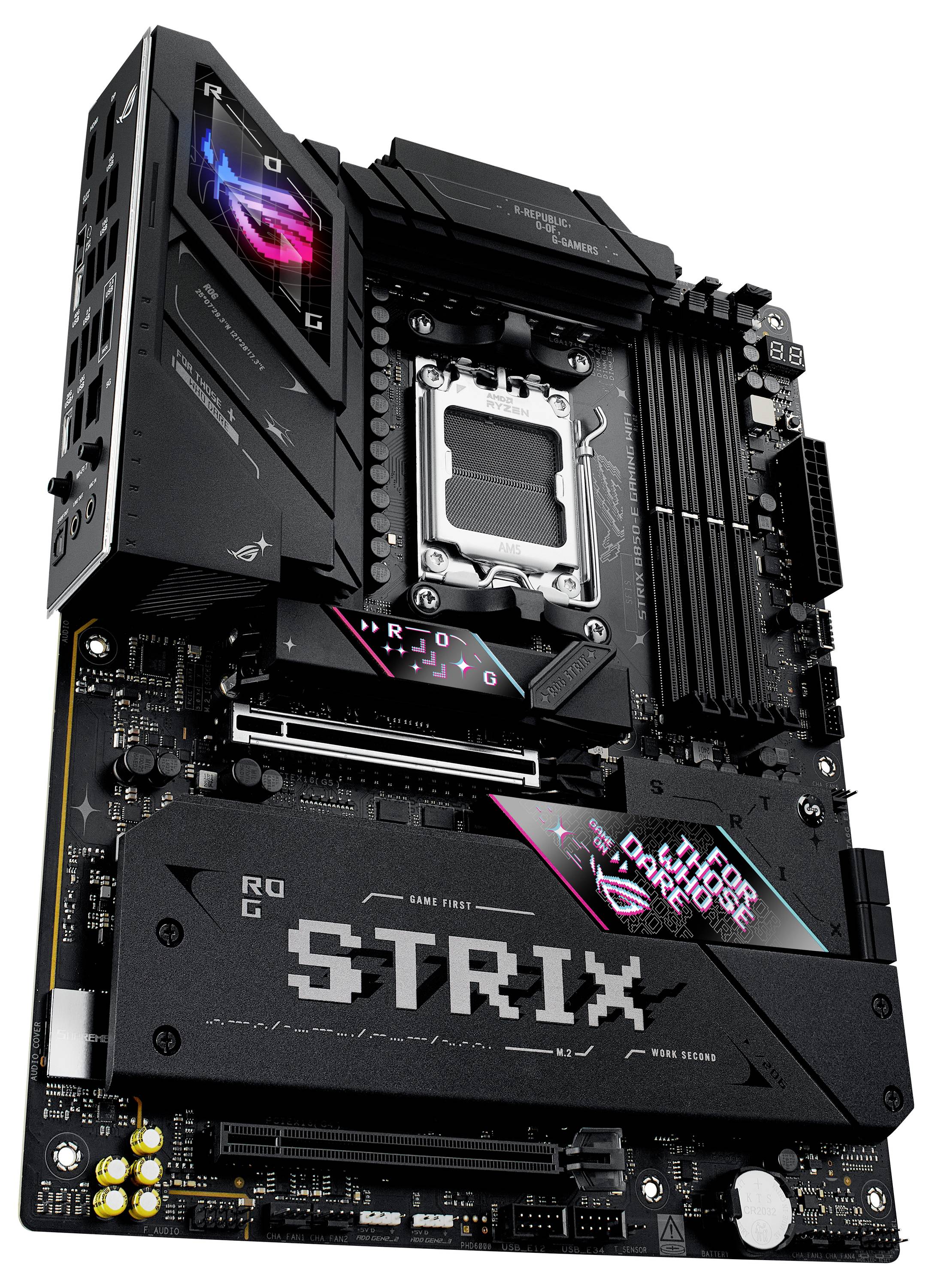 Ein schwarzes Desktop-Motherboard mit der Aufschrift 'ROG STRIX'. Es zeigt mehrere Steckplätze und farbige LED-Beleuchtungselemente.