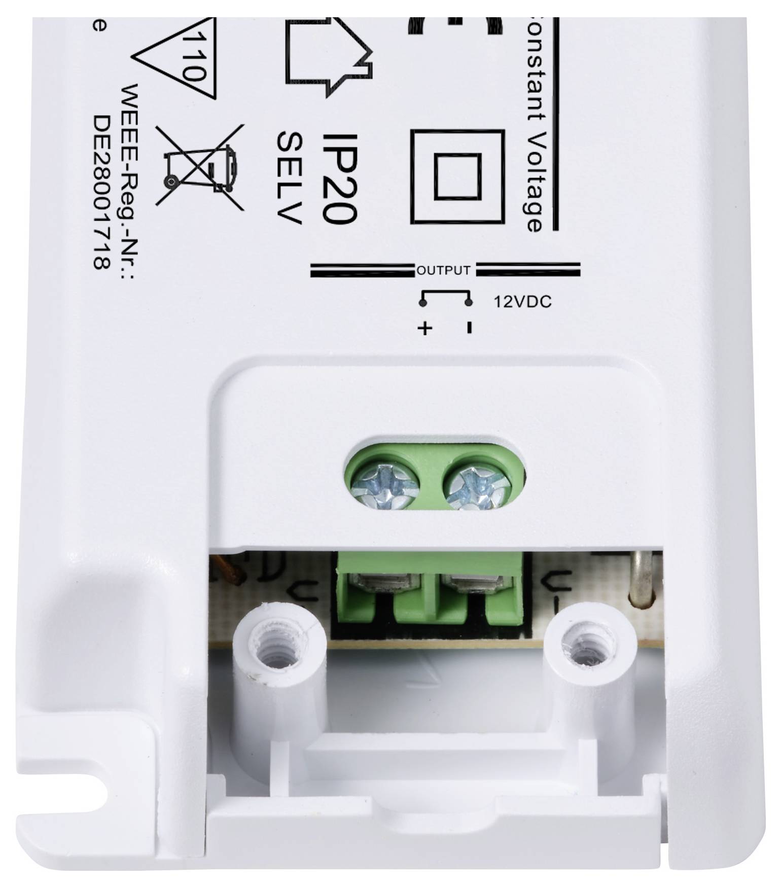 Nahaufnahme eines weißen elektrischen Geräts mit Anschlussklemmen und Aufdruck 'IP20', zeigt Spannungsausgabe von 12V DC.