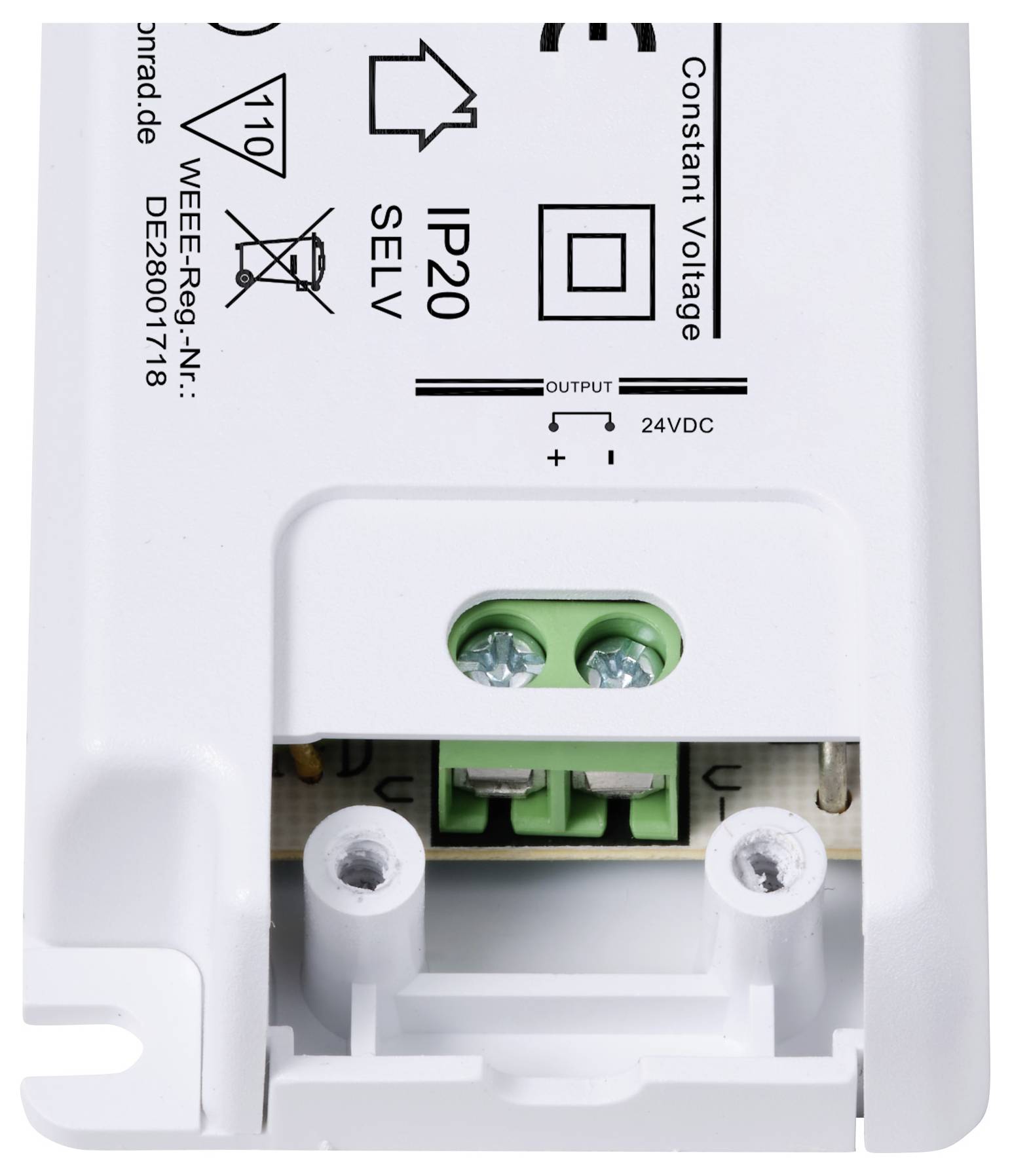 Weißes elektrisches Gerät mit Aufdrucken wie 'IP20', '24VDC', Symbolen und Anschlussschrauben, wahrscheinlich ein Spannungsadapter.