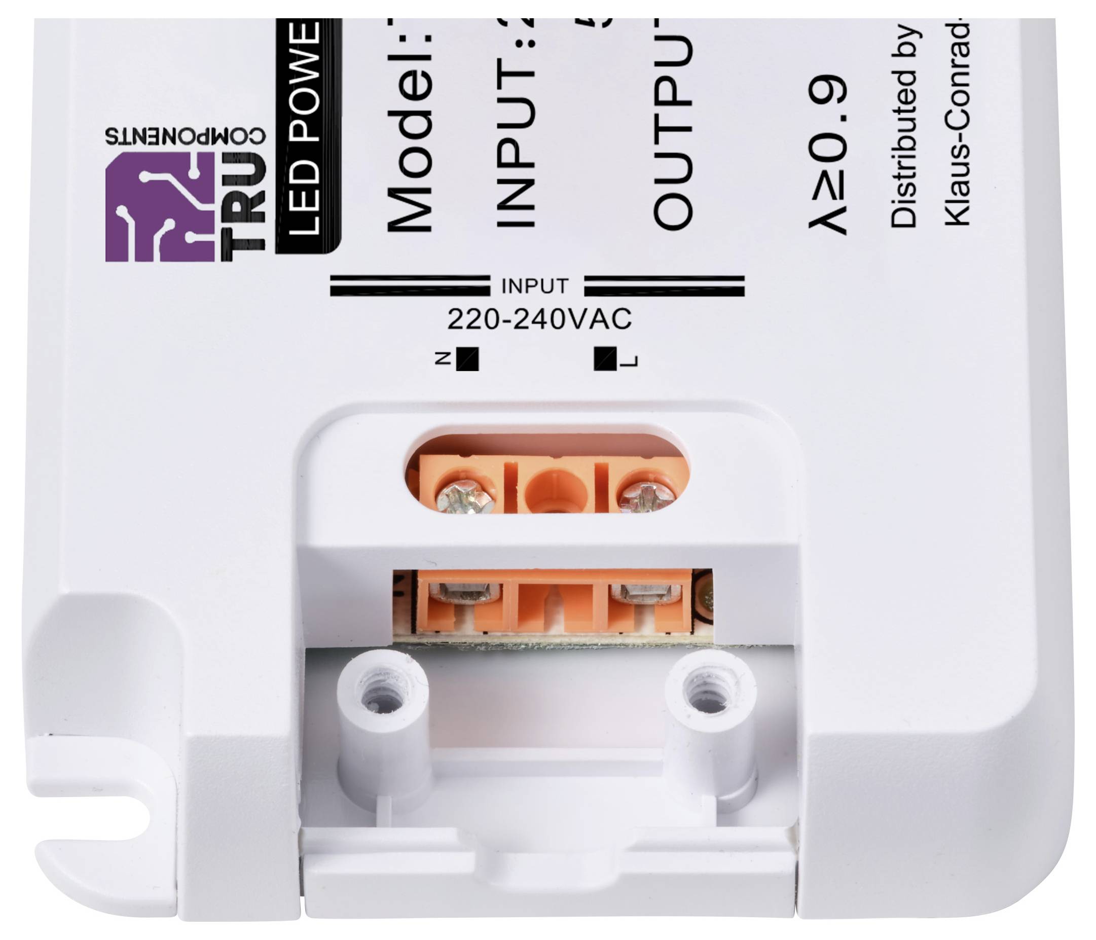 Ein weißes LED-Netzteil mit den Anschlüssen für Eingang und Ausgang. Oben links steht 'TRU Components'. Eignet sich für 220-240VAC.