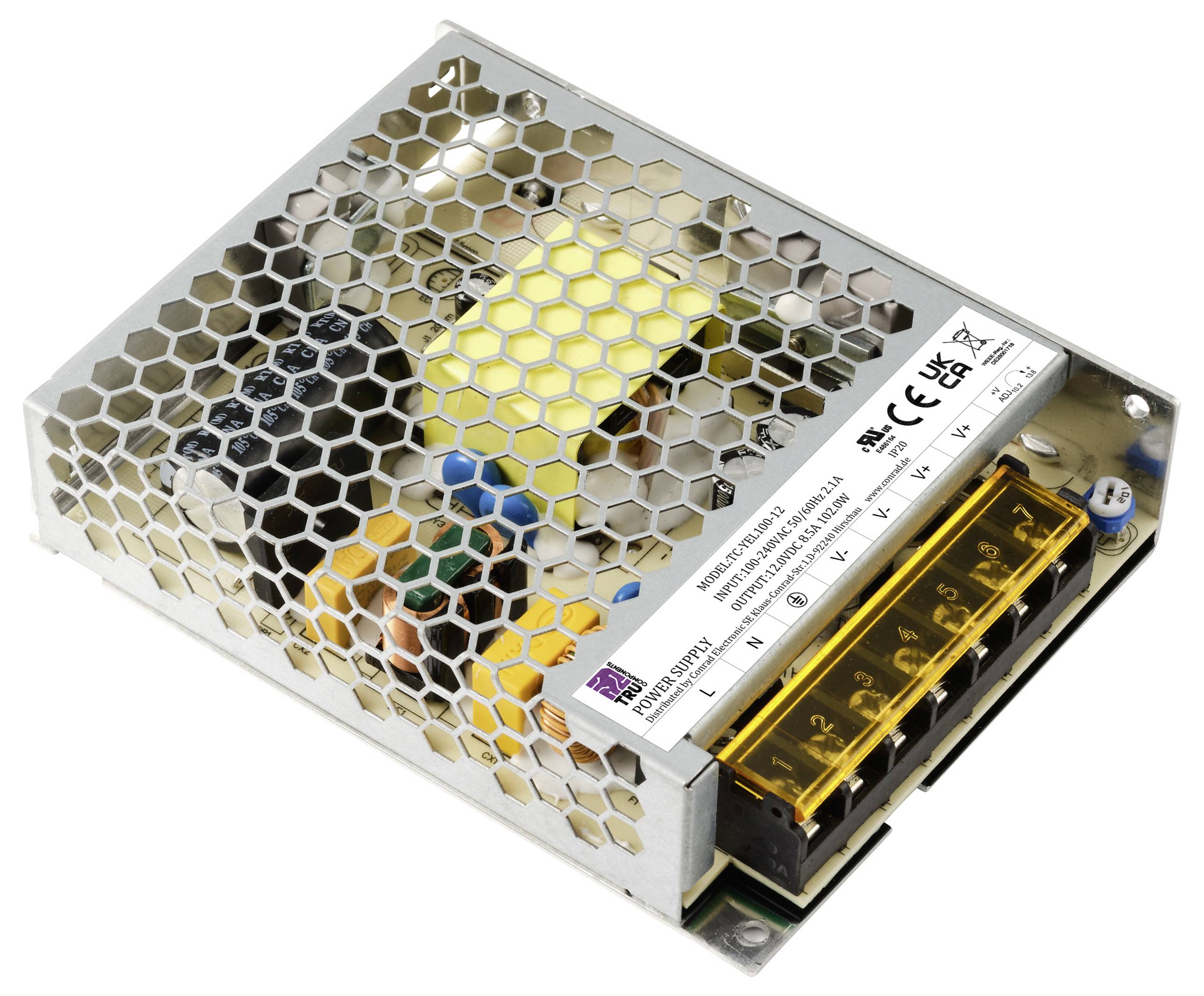 Metallisches Netzteil mit Lüftungsgitter, elektrischen Komponenten und Beschriftung mit technischen Spezifikationen.