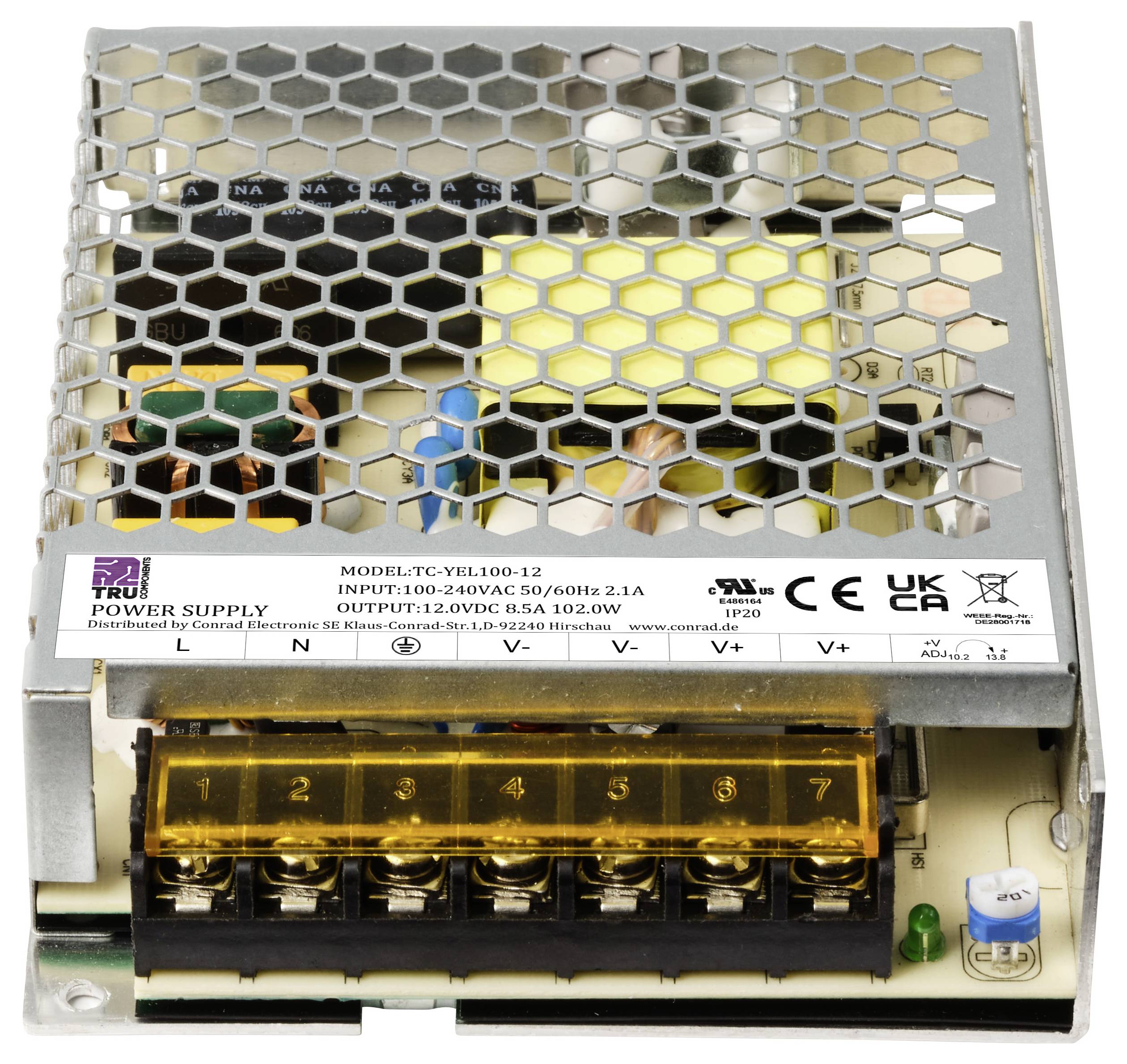 Ein offenes Netzteilgehäuse mit sichtbaren elektronischen Komponenten und einer Anschlussleiste.