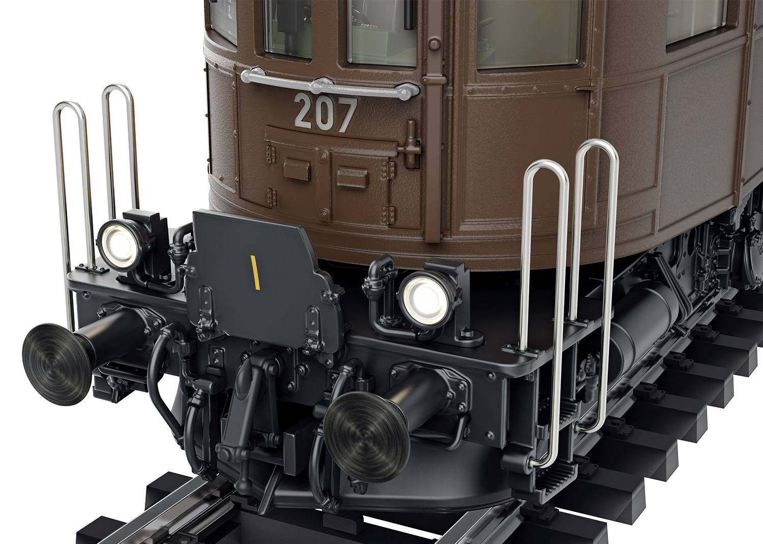 Nahaufnahme einer historischen braunen Lokomotive auf Schienen. Vorne ist die Nummer '207' zu sehen, mit zwei Scheinwerfern und metallischen Details.