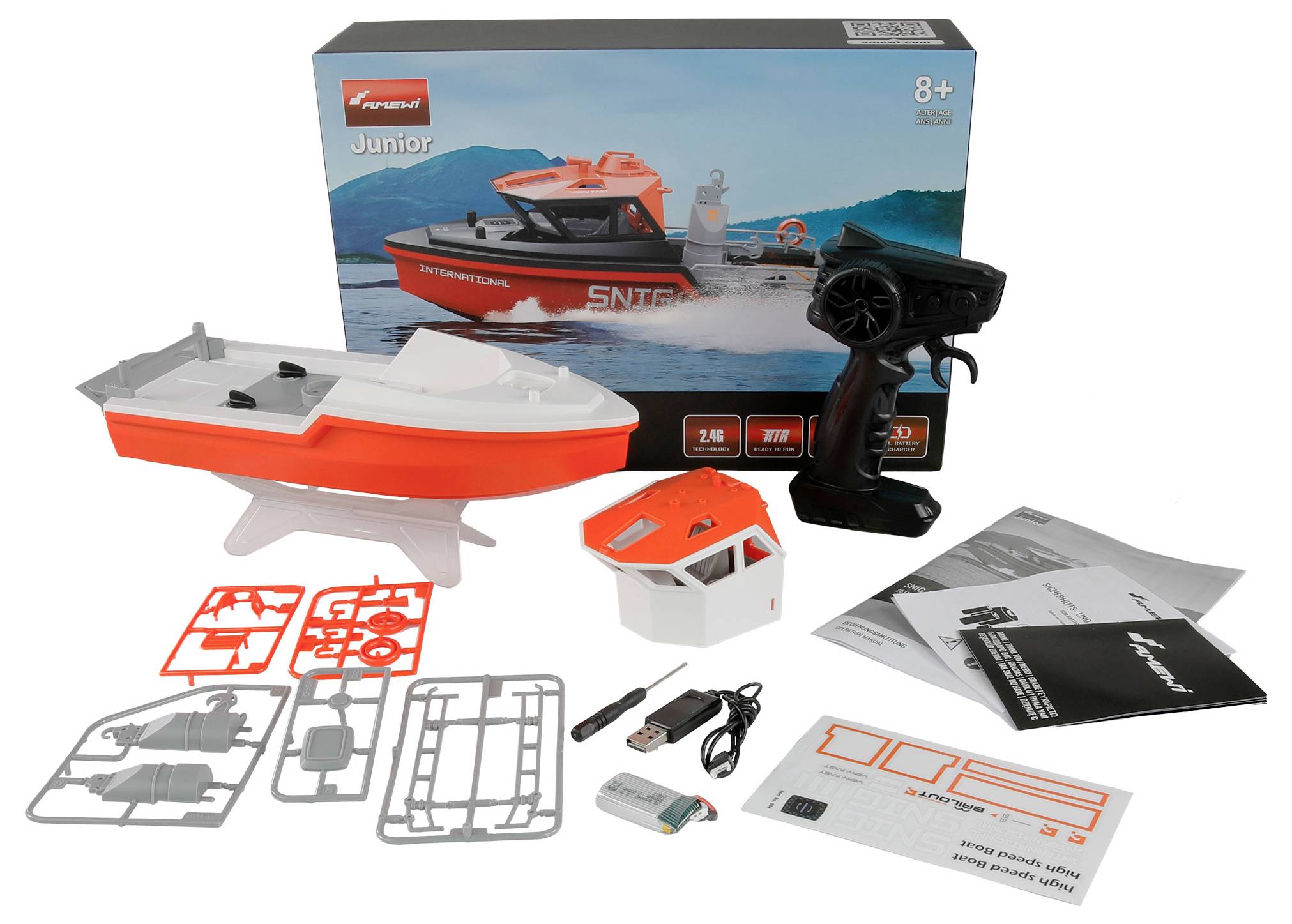 Modellboot-Bausatz mit Boot, Fernbedienung, Anleitung und Zubehör. Verpackung zeigt fertiges Boot auf Wasser. Ab 8 Jahren geeignet.