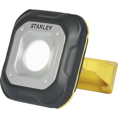 Tragbare Arbeitsleuchte mit quadratischem Gehäuse in Schwarz und Gelb, zentralem, runden LED-Licht und klappbarem Ständer.