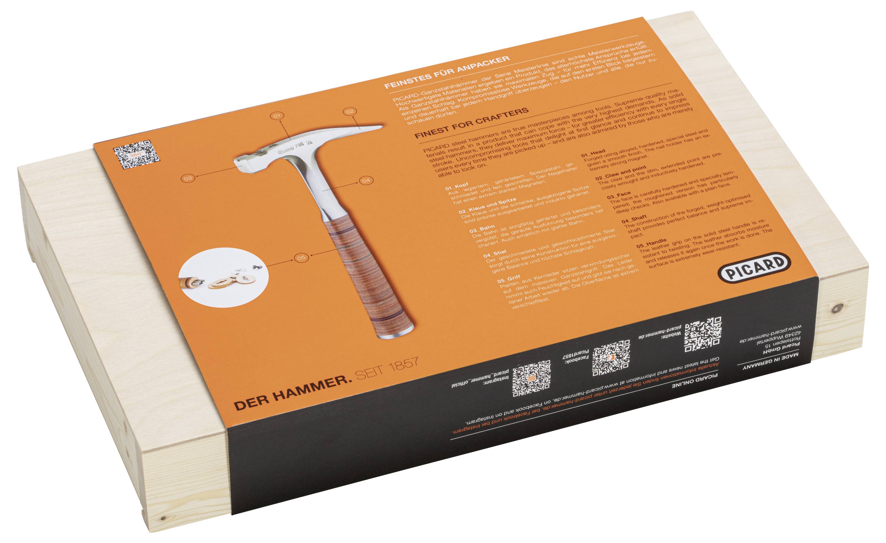 Holzkiste mit orangefarbenem Aufdruck, zeigt einen Hammer mit Holzgriff und der Aufschrift 'DER HAMMER - Seit 1867'.