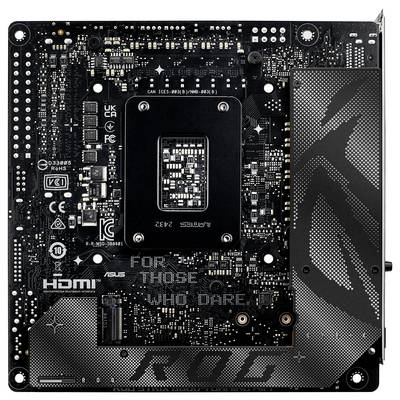 Eine Computermotherboard mit 'STRIX' Branding, mit freiliegendem zentralem Prozessorsockel und mehreren Kühlkörpern in einem kompakten Design.