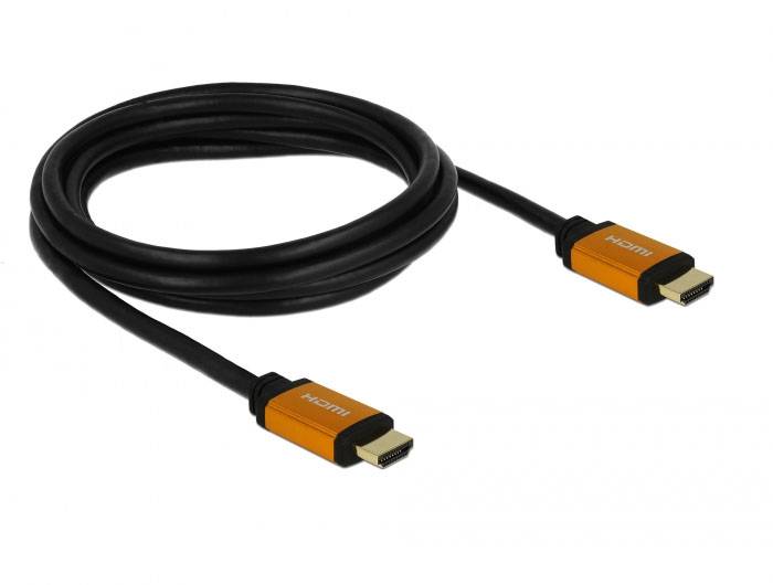 Ein schwarzes HDMI-Kabel mit orangefarbenen Anschlüssen liegt aufgewickelt.