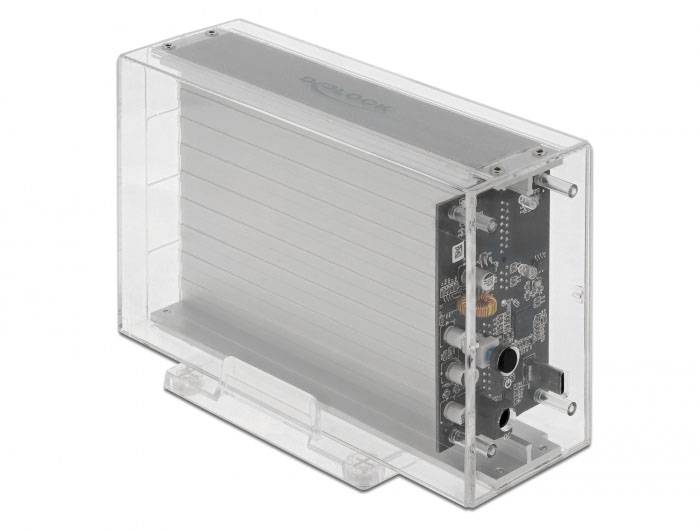 Ein elektronisches Gerät in transparenter Schutzhülle. Sichtbar sind Anschlüsse und elektronische Bauteile auf einer Platine.