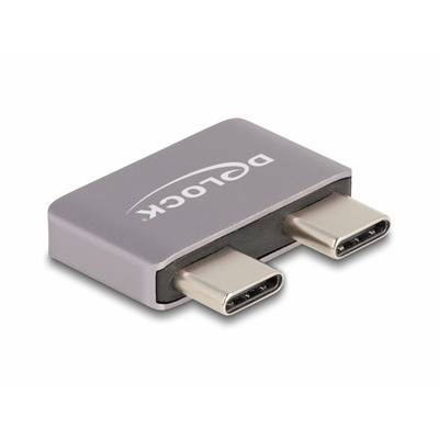 Ein Adapter für zwei USB-C-Stecker, silberfarben, mit aufgedrucktem 'DELOCK'-Logo.