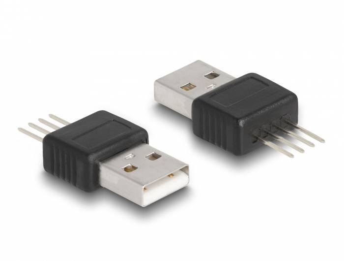 Zwei USB-Steckeradapter mit schwarzem Kunststoffgehäuse und Metallstiften liegen auf einer Oberfläche.