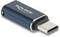 USB-C Adapter von Delock, schwarz mit silbernem Rand, für Verbindungszwecke in technologischem Kontext.