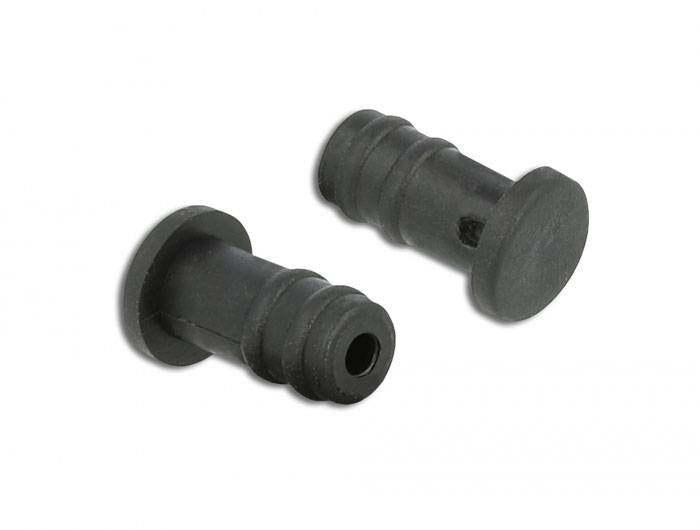 Zwei schwarze Kunststoffdübel auf weißem Hintergrund, einer liegend, der andere stehend.