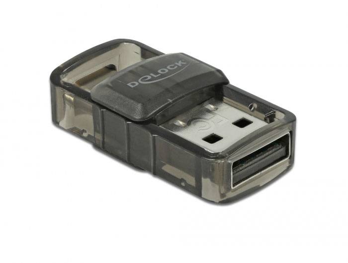 Ein USB-Adapter mit transparentem Gehäuse und schwarzem Element oben, auf dem 'DeLOCK' steht. Adapter zum Anschließen von Geräten.