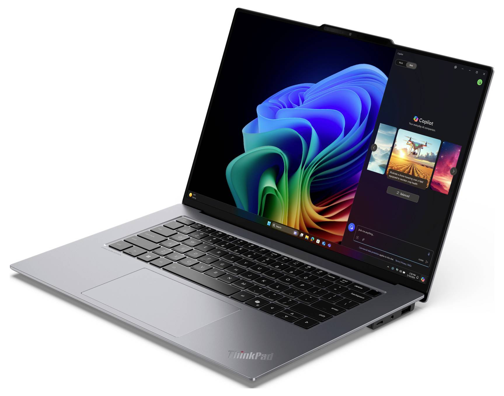 Ein Laptop mit aufgeklapptem Bildschirm zeigt einen bunten, abstrakten Windows-Hintergrund. Rechts ist eine Musik-App geöffnet.