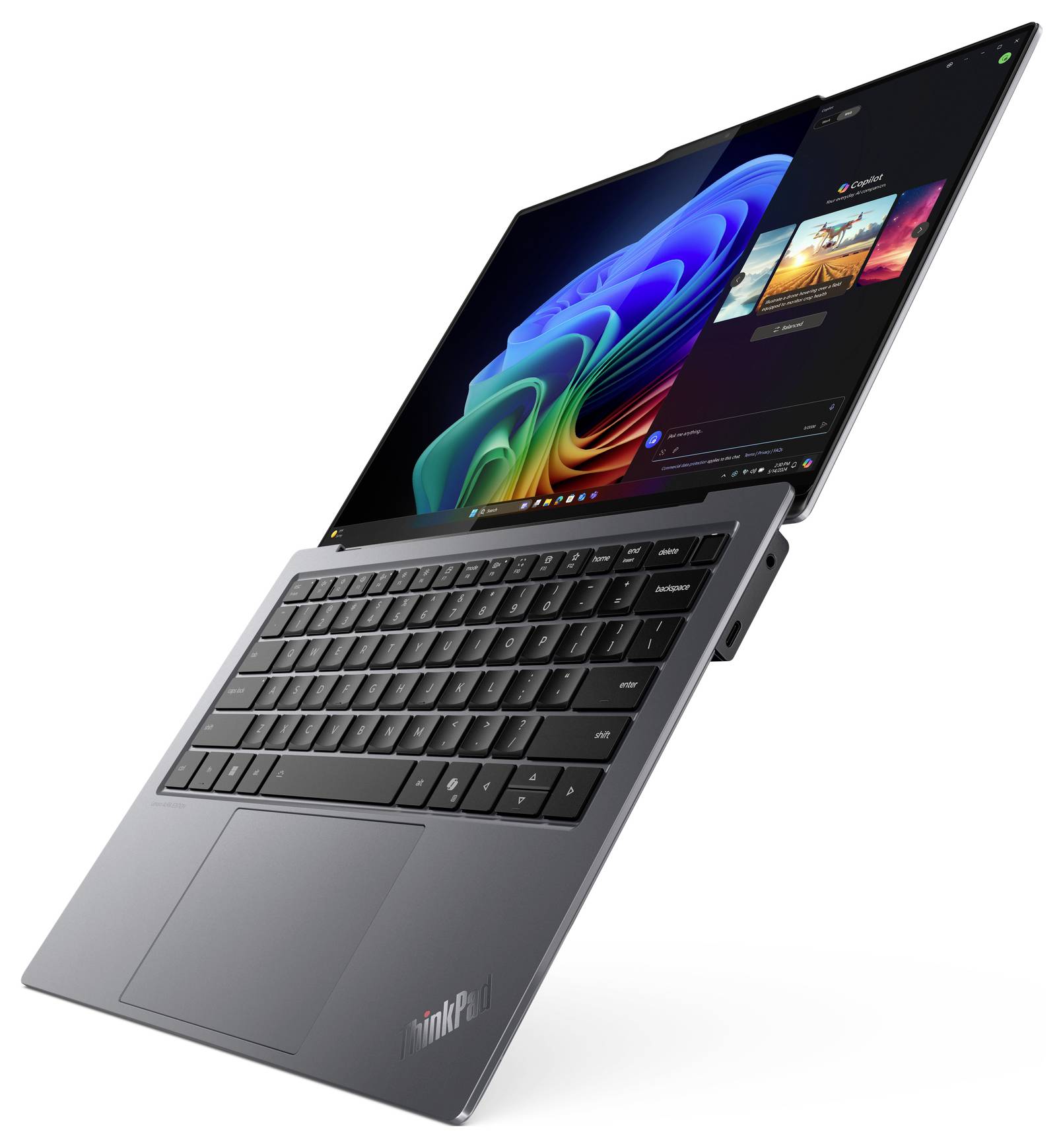 Ein silbernes Laptop mit geöffnetem Bildschirm zeigt farbenfrohe Grafiken und ein schwarzes Tastaturdesign. Es ist leicht angewinkelt.