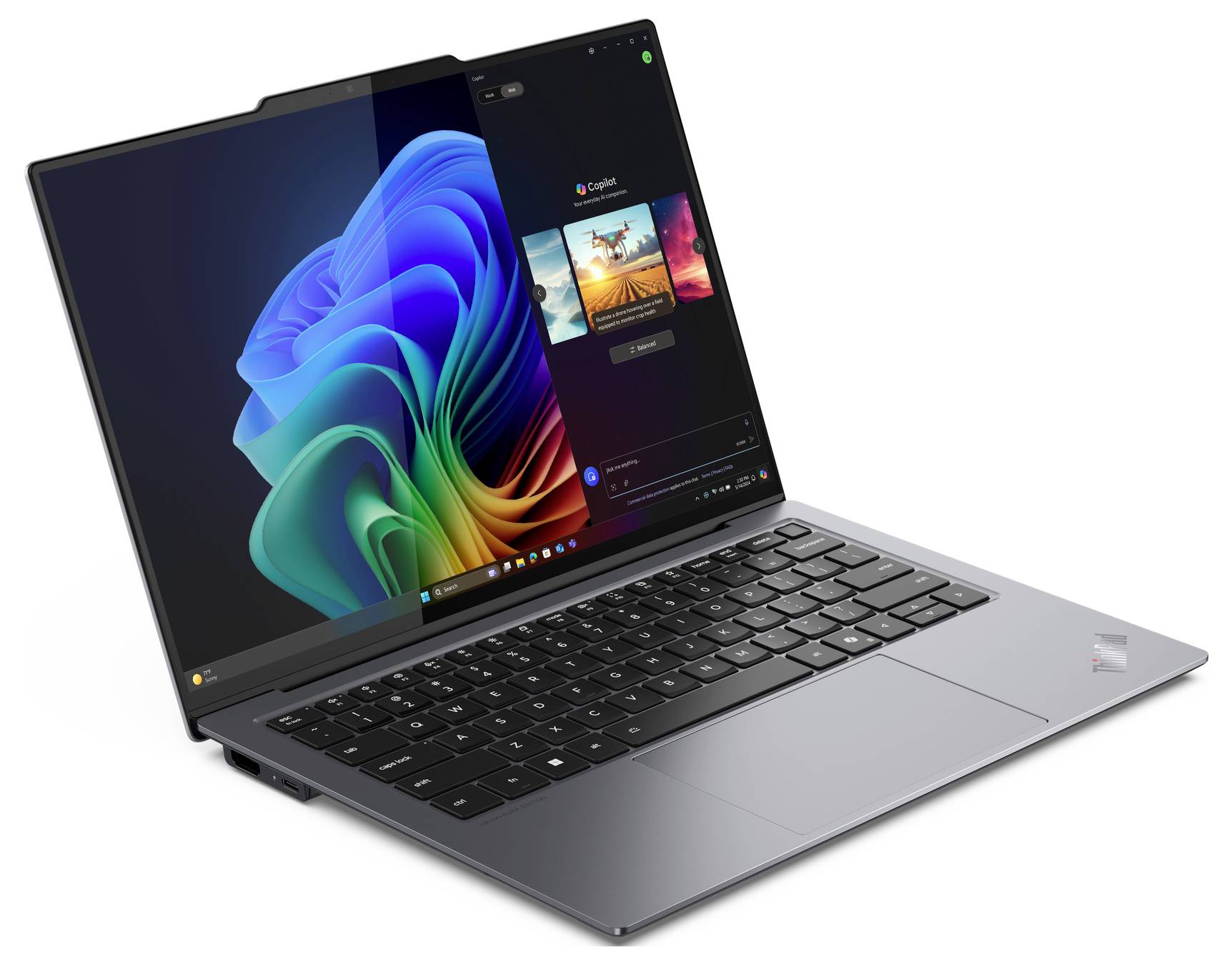 Ein moderner, geöffneter Laptop mit einem farbenfrohen Bildschirmhintergrund. Die Tastatur ist schwarz, und der Laptop steht auf einem weißen Hintergrund.