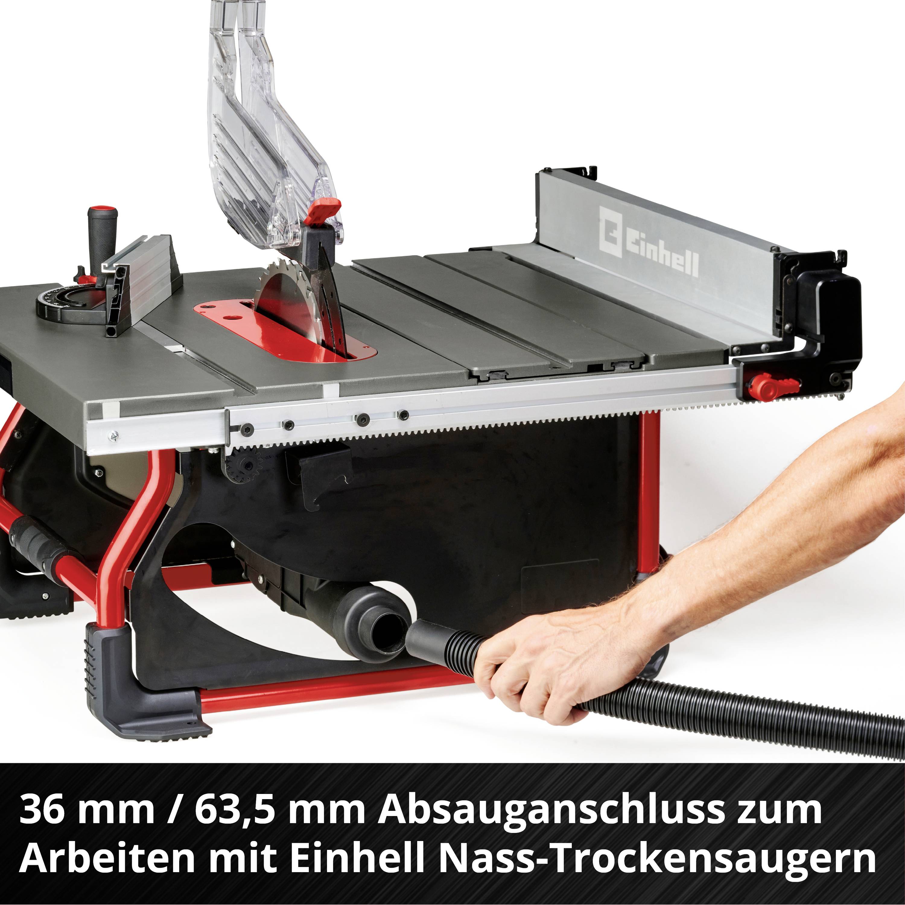 Einhell Tischkreissäge mit Hand, die an einen Absaugstutzen angeschlossen wird. Text unten: '36 mm / 63,5 mm Absauganschluss zum Arbeiten mit Einhell Nass-Trockensaugern'.