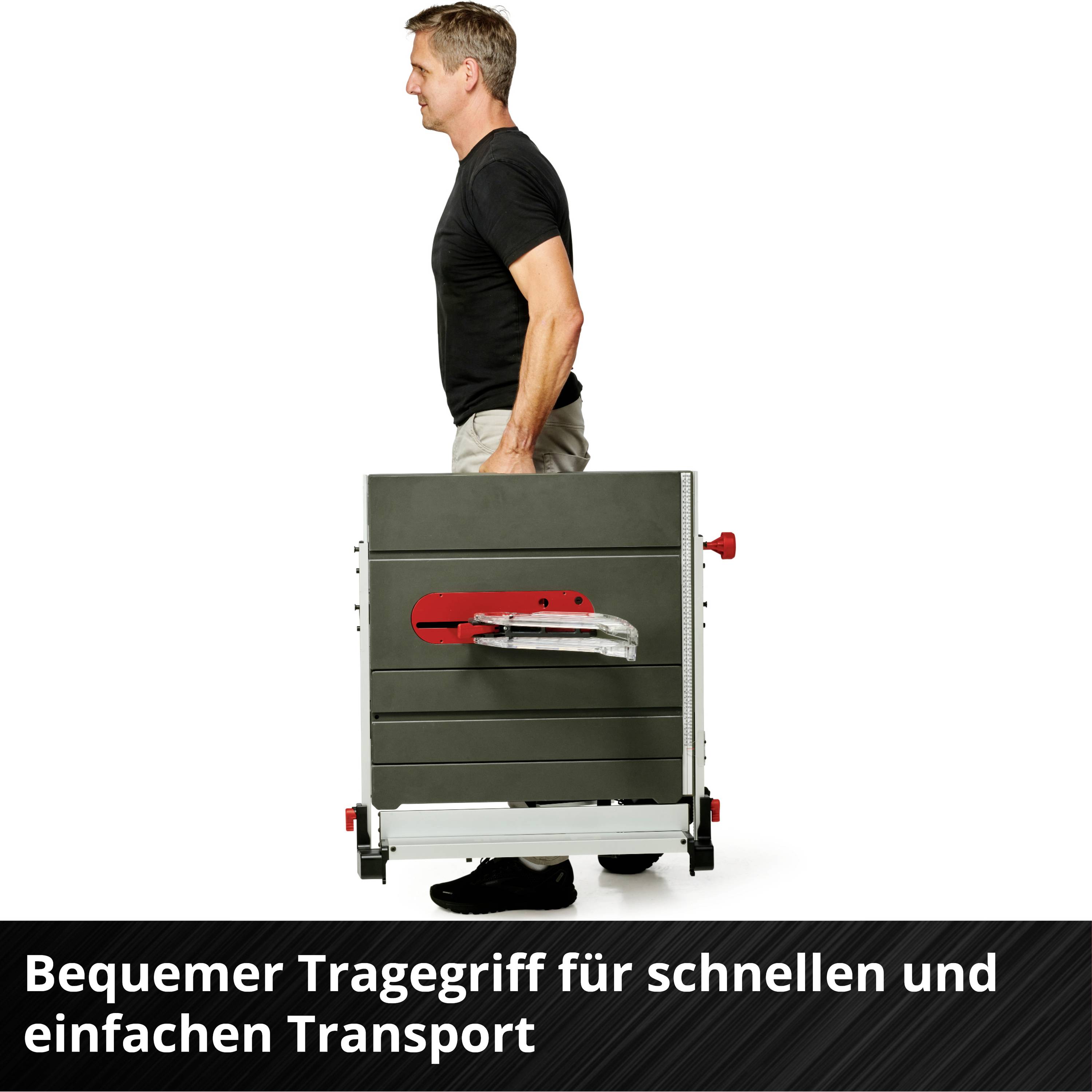 Ein Mann in schwarzem T-Shirt und Jeans hebt eine tragbare Tischsäge mit Griff an. Text im Bild: 'Bequemer Tragegriff für schnellen und einfachen Transport'.
