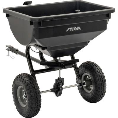Ein schwarzer Streuwagen mit zwei großen Gummirädern und Anhängerkupplung. Modellname 'STIGA' auf der Vorderseite.