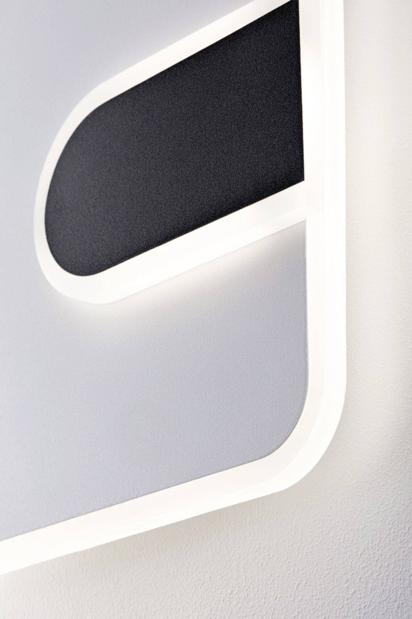 Ein minimalistisches, abstraktes Kunstwerk mit geschwungenen Formen in Schwarz und Weiß, die harmonisch ineinandergreifen.