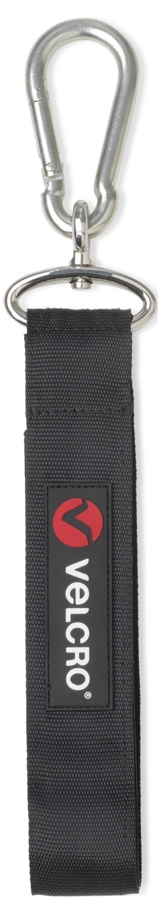'Silberner Karabinerhaken mit schwarzem Stoffband, darauf ein rot-weißes Logo und der Schriftzug 'VELERO'.'