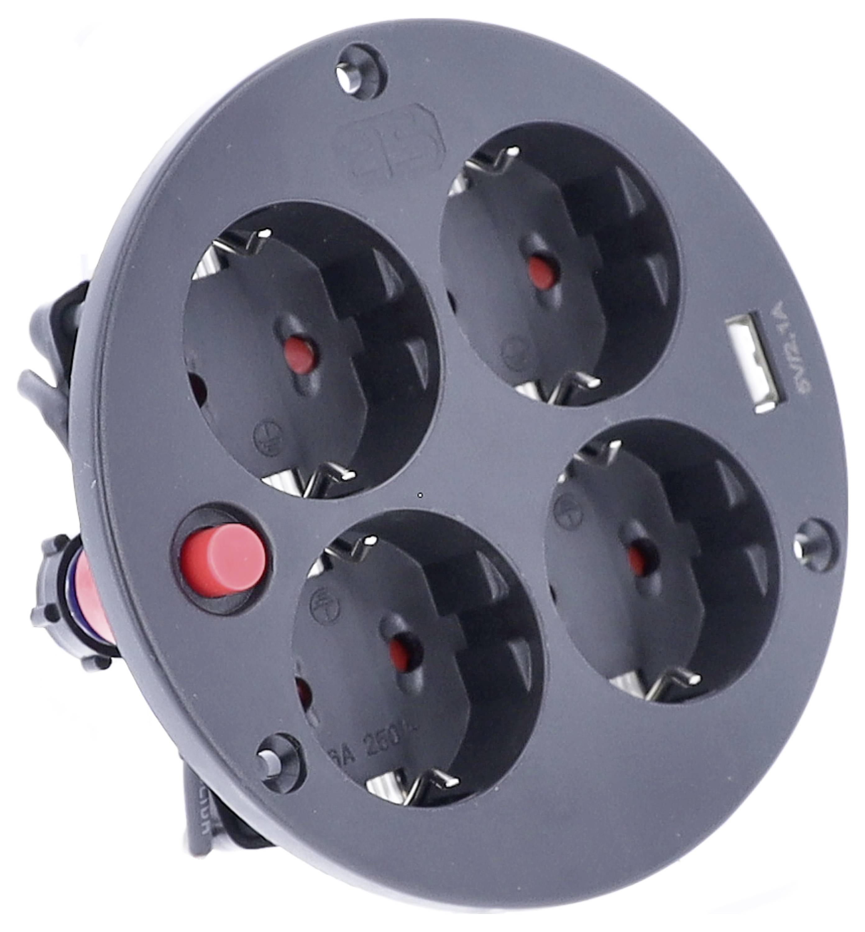 Ein runder, schwarzer Mehrfachstecker mit vier Steckdosen, einem USB-Anschluss und einem roten Schalter.