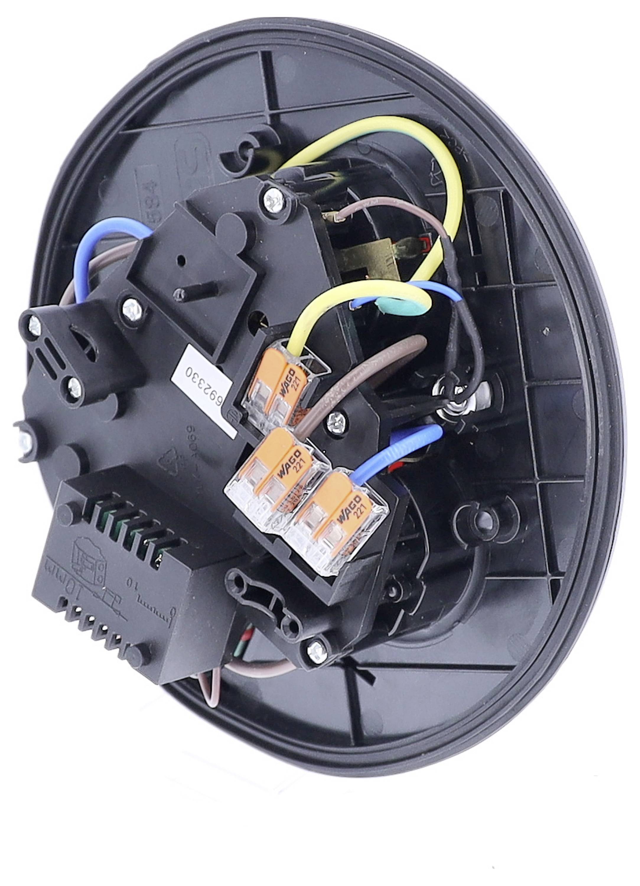 Ein elektrisches Bauteil mit mehreren Kabeln und Klemmen ist auf einer runden, schwarzen Basis montiert.