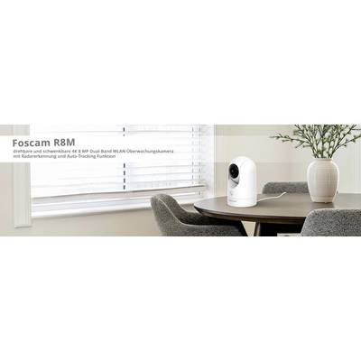 Überwachungskamera auf einem Tisch in einem modernen Raum. Text auf dem Bild: 'Foscam R8M, drehbare WLAN-Kamera mit Radarerkennung'.