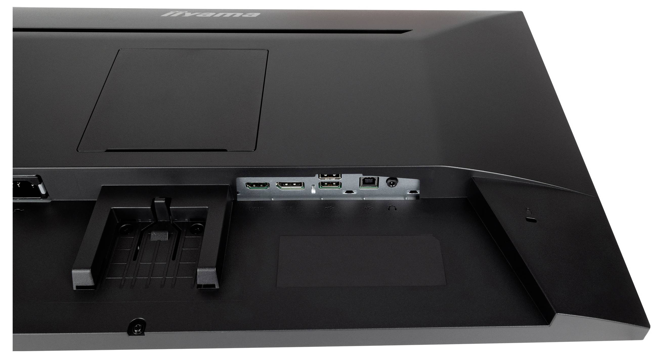 Rückseite eines Monitors mit geöffnetem Anschlussfeld. Sichtbar sind mehrere Anschlüsse, darunter HDMI und USB.