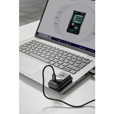 Ein Laptop zeigt eine Anzeige für CO2-Werte. Ein Messgerät ist mit dem Laptop verbunden und zeigt einen CO2-Wert von 380 ppm an.