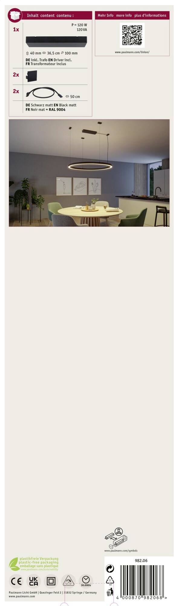 Bild eines Esszimmerbereichs mit einem runden Tisch, vier grünen Stühlen und ein modernes ringförmiges Licht über dem Tisch.