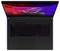 Laptop von oben mit beleuchteter RGB-Tastatur und Bildschirm in Blau-Rot. Oben auf dem Bildschirm steht 'ROG STRIX 2023 Gamer'.