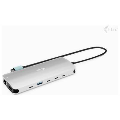Ein silberner USB-C-Hub mit mehreren Anschlüssen, darunter USB, HDMI und Ethernet. Ein schwarzes Kabel ist angeschlossen.