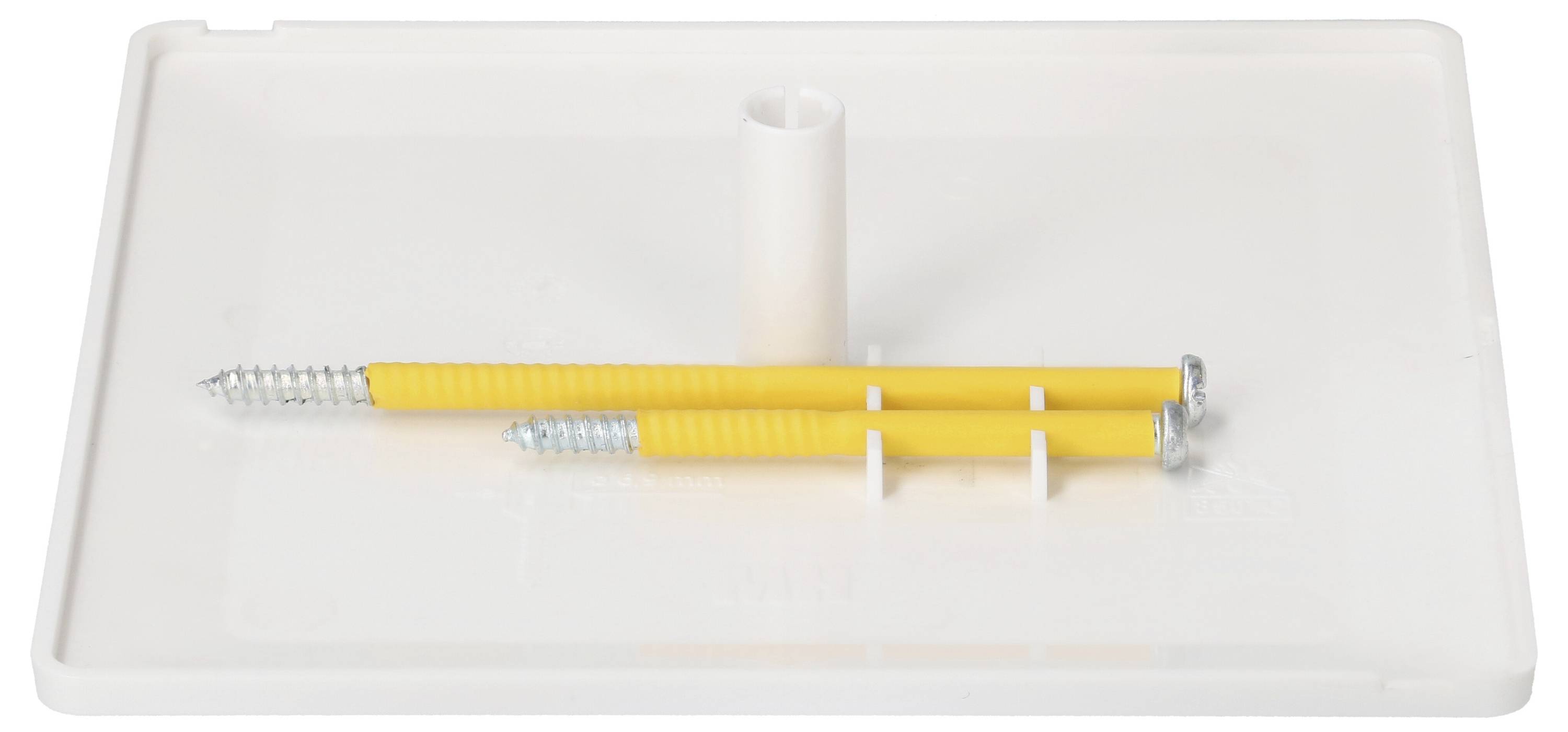 Zwei gelbe Dübel mit Schrauben liegen auf einer weißen rechteckigen Plastikplatte mit einer zentralen Bohröffnung.