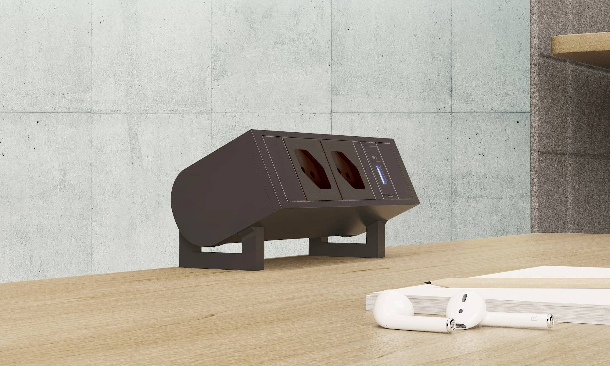Schwarze Tischsteckdose mit zwei Steckplätzen und einem USB-Anschluss auf einem Holztisch vor einer grauen Wand.