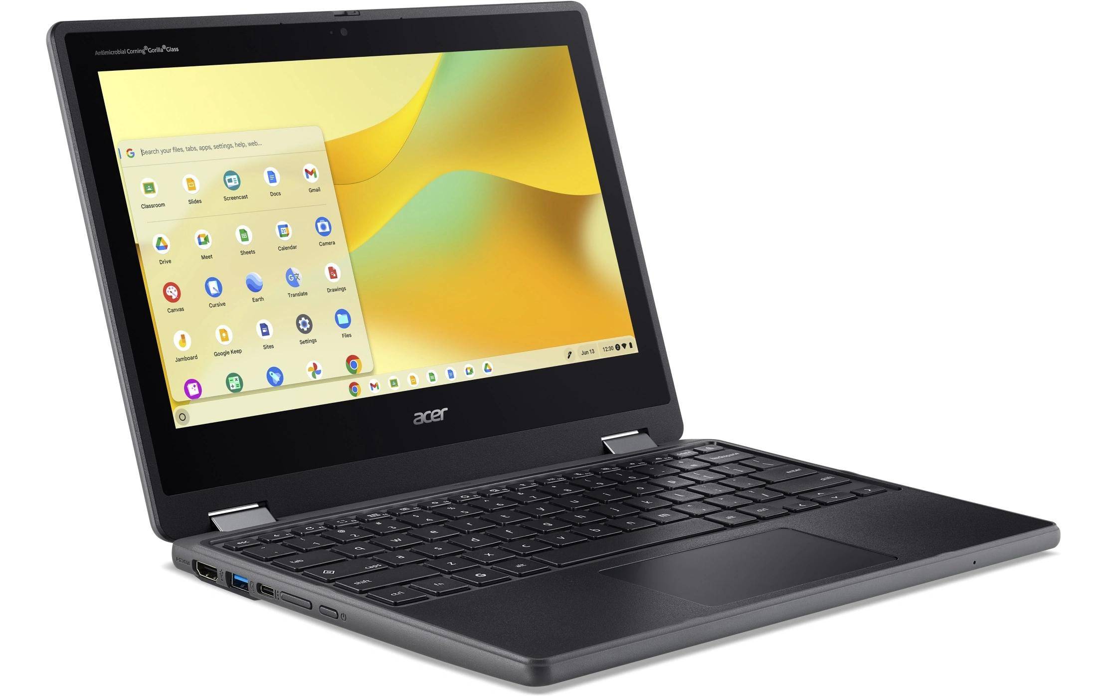 Ein Laptop mit geöffneter Display-Anzeige zeigt den Startbildschirm eines Betriebssystems mit verschiedenen App-Symbolen.