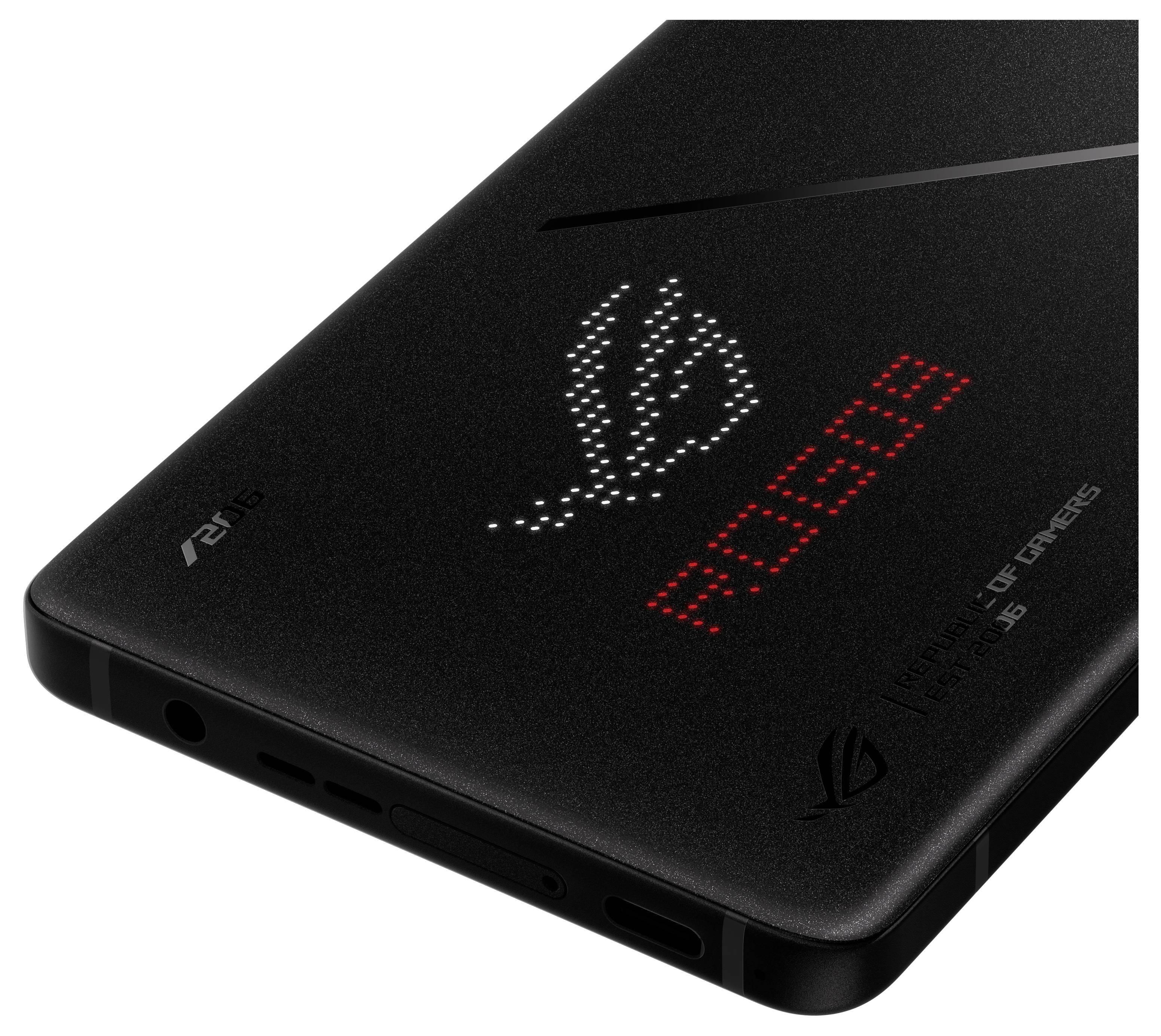 Rückseite eines schwarzen Gaming-Smartphones mit leuchtendem Pixel-Logo und 'ROG' Schriftzug in Rot.