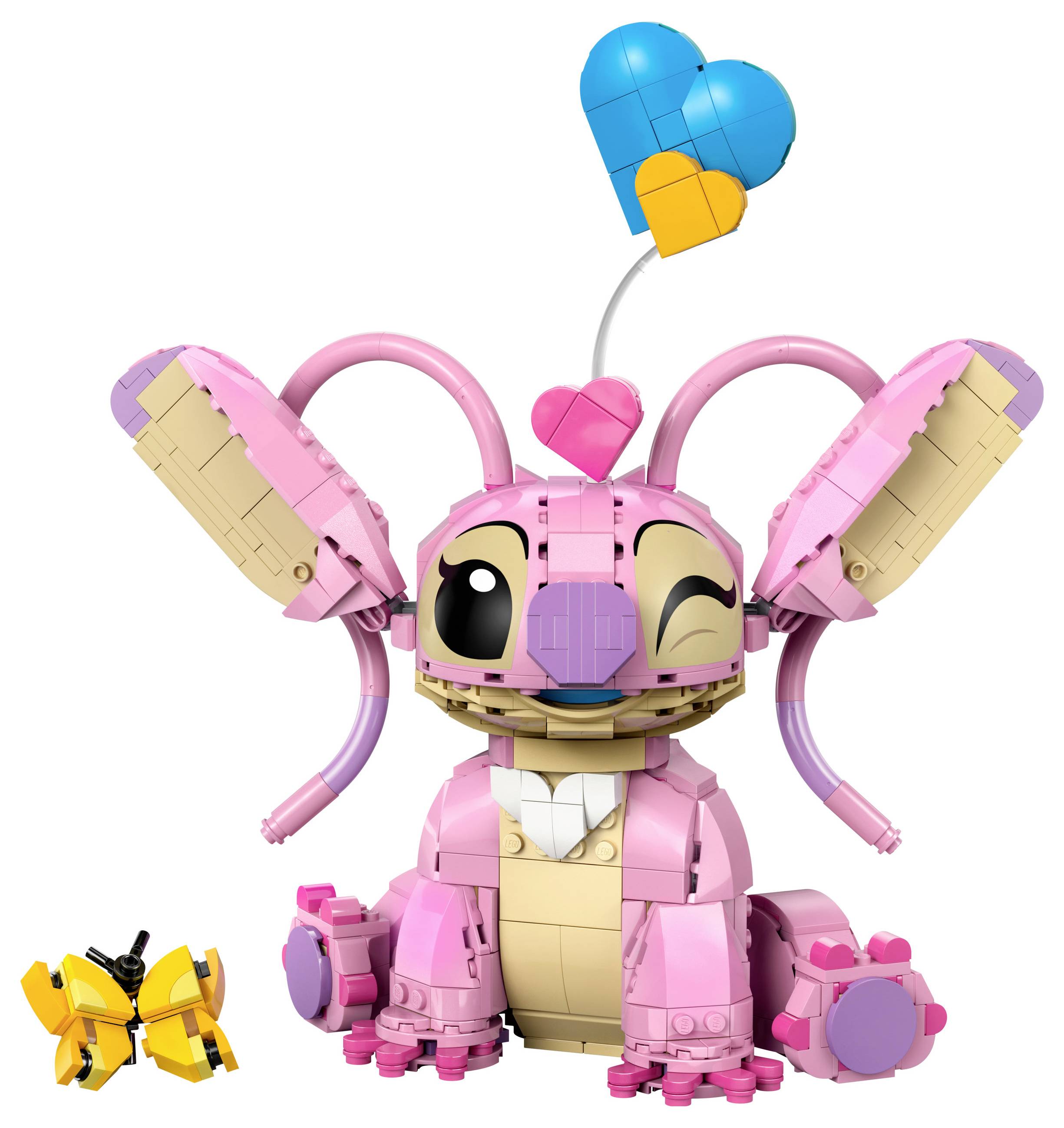 Ein pinkes Spielzeughäschen aus Bausteinen mit einem blauen und orangen Herzluftballon. Daneben sitzt ein kleiner Schmetterling aus Bausteinen.